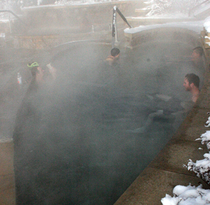 People swimming at Old Town Hot Springs in Steamboat Springs, CO