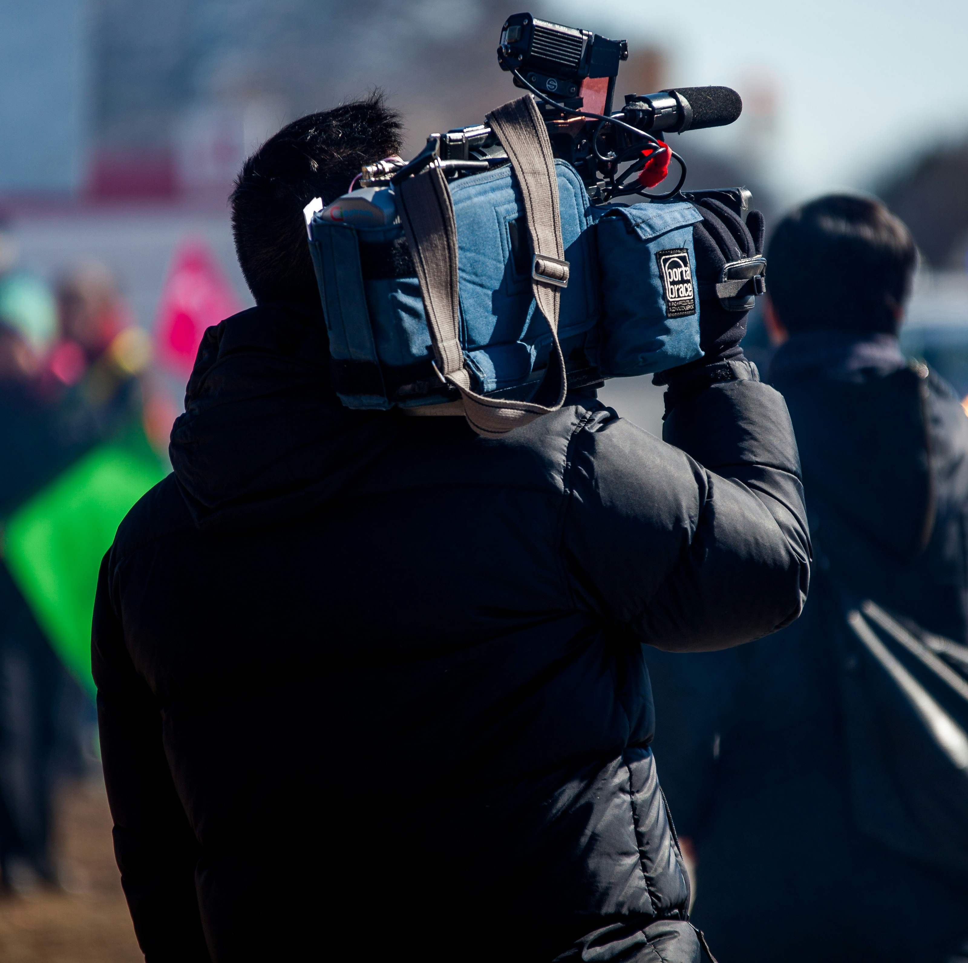 A camera man films a scene