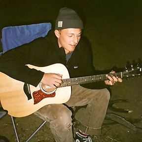 Musician Nick Simon playing guitar